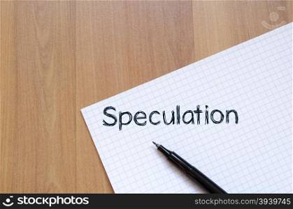 Speculation text concept write on notebook with pen