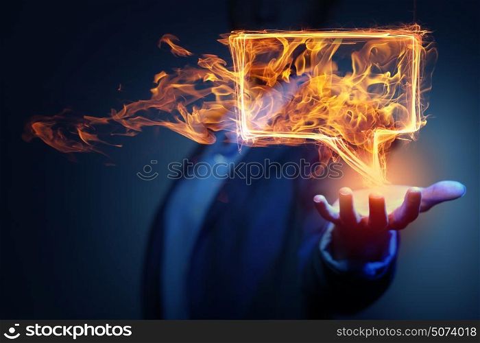 Speech fire icon. Fire glowing speech bubble icon on dark background