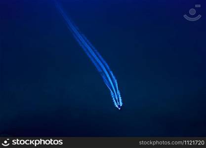 speed boat passenger and water splash blue sea background at night aerial top view from drone