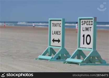 speed signs on a beach