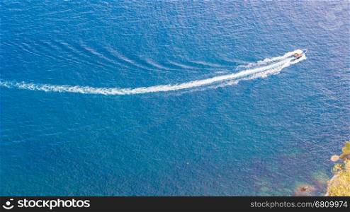 Speedboat cruising over the blue Mediterranean Sea