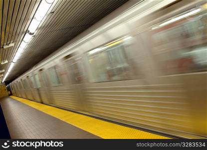 Speeding underground subway train.