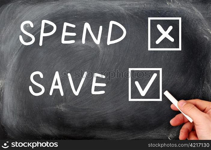 Spend and Save check boxes on a blackboard, with a hand holding chalk