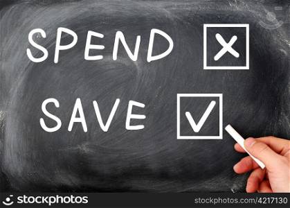 Spend and Save check boxes on a blackboard, with a hand holding chalk