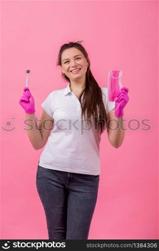 Spend less on dentist. Happy girl hold brushes on pink background.Dentist and dentistry. Dentist that makes smile. beautiful pediatric dentist.. Spend less on dentist. Happy girl hold brushes on pink background.Dentist and dentistry. Dentist that makes smile. beautiful pediatric dentist