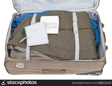 sphygmometer and jacket packed in suitcase isolated on white background