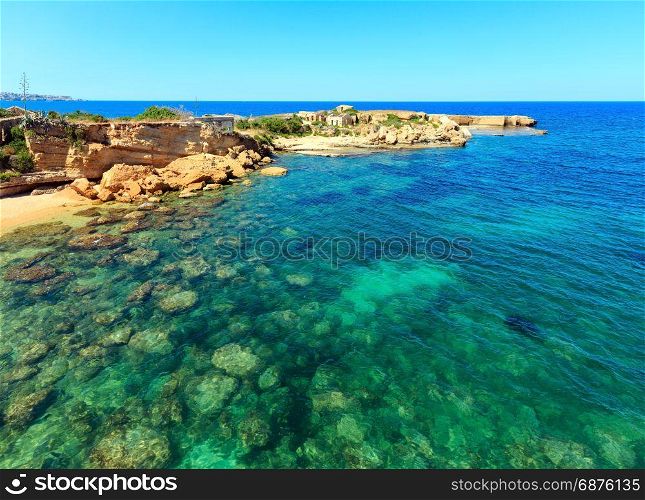 Spiaggia Massolivieri beach summer sea landscape (Siracusa, Sicily, Italy). People unrecognizable.
