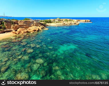 Spiaggia Massolivieri beach summer sea landscape (Siracusa, Sicily, Italy). People unrecognizable.