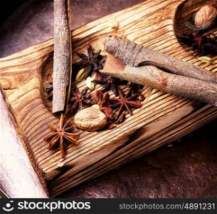 spice star anise. spice anise and cinnamon in a wooden mortar