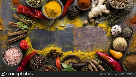 Spices and herbs and Wooden bowl. Spices over wooden background