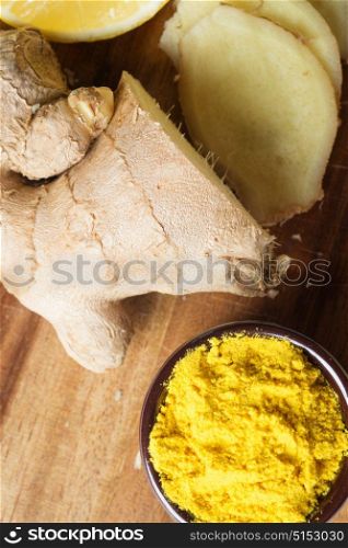 Spices and herbs in ceramic bowls. curcuma and ginger seasoning. Colorful natural additives.