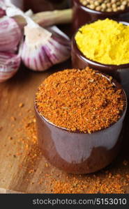 Spices and herbs in ceramic bowls. Food and cuisine ingredients. Colorful natural additives.