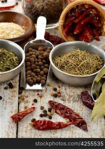 Spices And Herbs On A Wooden Table