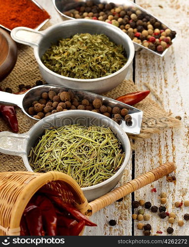 Spices And Herbs On A Wooden Table