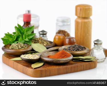 spices arrangement on a wooden board , close up