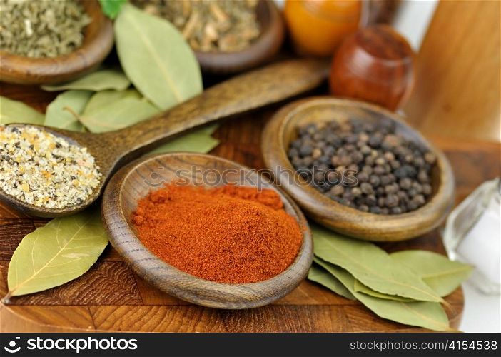 spices arrangement on a wooden board , close up
