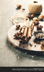 spices, autumn or winter cooking concept apple pie, cider, vinegar or mulled wine, wooden background. spices, autumn or winter cooking concept apple pie, cider, vinegar or mulled wine