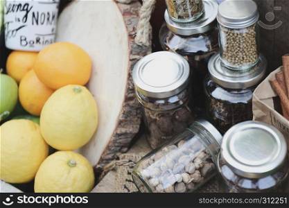 spices in bottles on wooden background