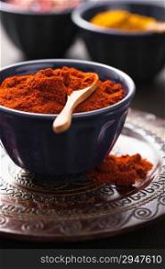 spices in bowls: paprika curry pink black pepper
