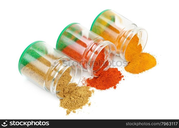 Spices in jars isolated on white background