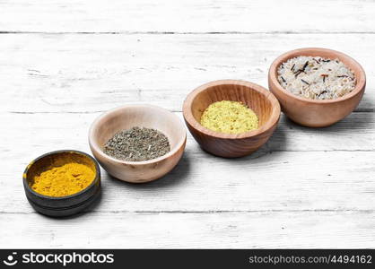 Spices in wooden bowl