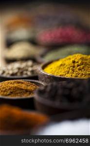 Spices on a wooden table, orintal cuisine vivid theme