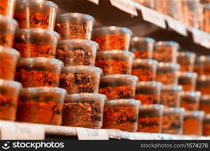 Spices on shelves for sale in the Jerusalem Souk.
