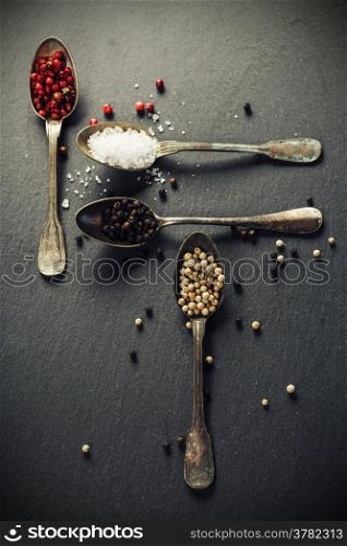 spices on slate background - cooking, healthy or vegetarian food concept