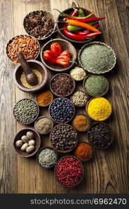 Spices on wooden bowl background