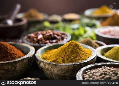 Spices on wooden bowl background . Cooking ingredient,spice