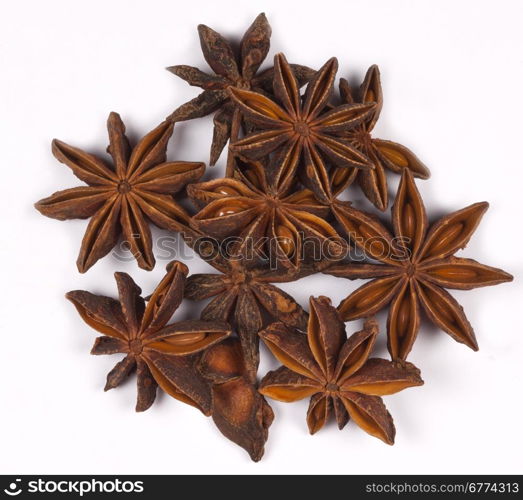 Spices - Star Anise is a small star-shaped fruit with one seed in each arm. It has an aniseed flavor and is used unripe as a spice in Asian cooking.