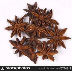Spices - Star Anise is a small star-shaped fruit with one seed in each arm. It has an aniseed flavor and is used unripe as a spice in Asian cooking.