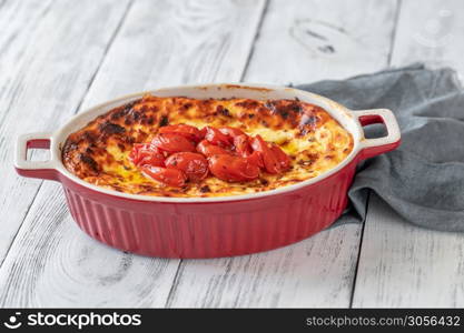 Spicy Baked Ricotta in baking dish flat lay