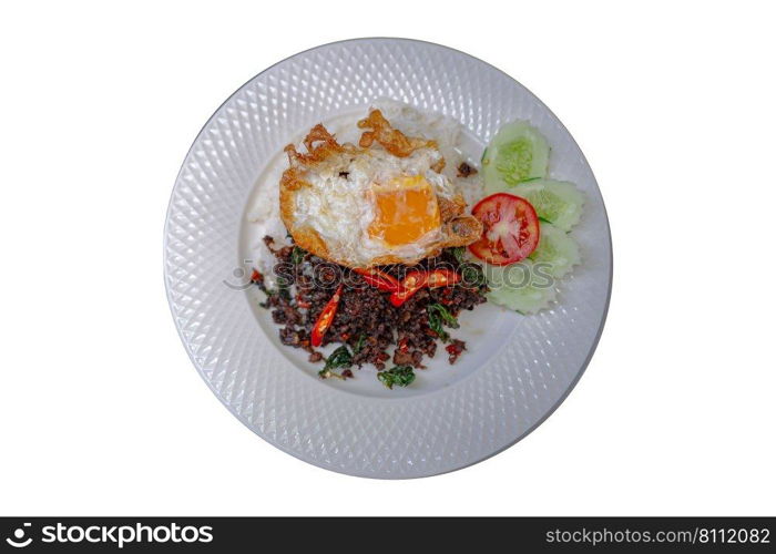 Spicy basil stir-fried beef and rice in a ceramic plate isolated on white background. Top view.