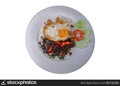 Spicy basil stir-fried beef and rice in a ceramic plate isolated on white background. Top view.