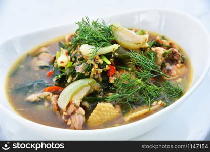Spicy chicken curry soup bowl with spices herb and vegetable - Thai style food