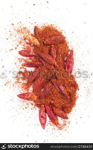 spicy chili powder with dry red peppers isolated on white background (chaotic version)