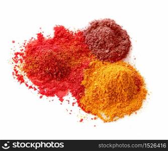 Spicy color powder chalk dust on white background isolated. Spicy color powders