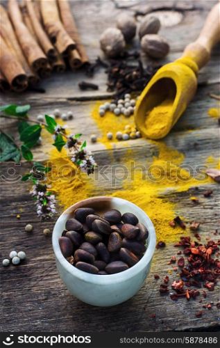 spicy food. Set of different spices on the old wooden table.Photo rustic