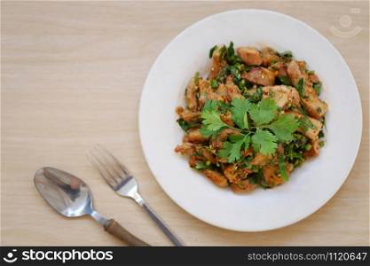 Spicy Grilled Pork Salad in dish of Popular Thai foods.