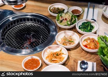 Spicy Kimchi group. Korean pickle or Pickled radish vegetables set and seasoning on bowl on stove serve wood table background, Japanese food