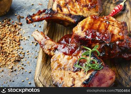 Spicy meat grilled spare ribs on wooden cutting board.Pork rack grilled. Pork ribs grilled