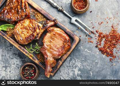 Spicy meat grilled spare ribs on wooden cutting board.Roasted ribs. Pork ribs grilled