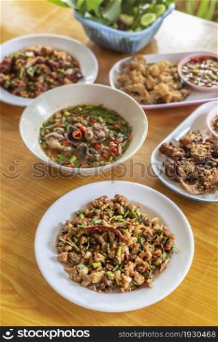 spicy minced meat with mixed vegetables and spicy soup on table. spicy minced meat with mixed vegetables on dish
