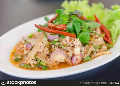 spicy minced pork eaten with fresh vegetable on plate , asian food