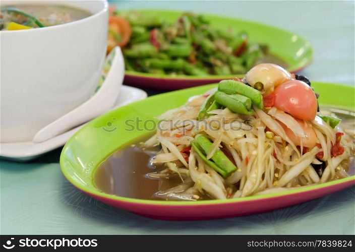 spicy papaya salad with crab and vegetable , asian meal