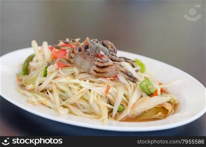 spicy papaya salad with crab on dish , asian spicy food