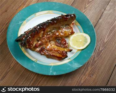 Spicy pork ribs in orange sauce