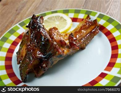 Spicy pork ribs in orange sauce
