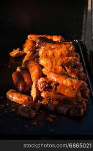 Spicy sausages on the plate ready to be eaten. Grilling sausages on grill